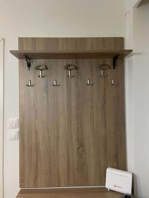 Wall coat rack like new with dimensions 0.97W x 1.36H