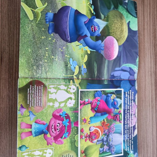 Trolls Topps sticker album used with 106 stickers attached