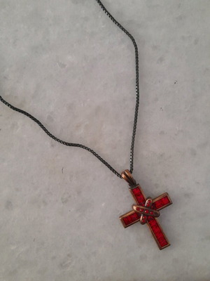 Cross necklace used, black and red, missing one bead