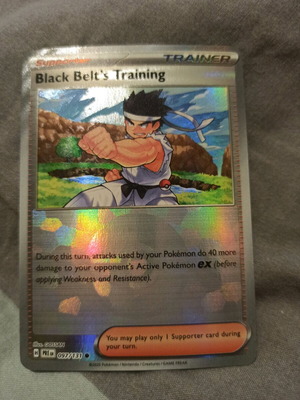 Black Belt's Training holo Pokémon card near mint from Prismatic Evolutions set