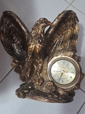 Decorative eagle used with clock and minor damage