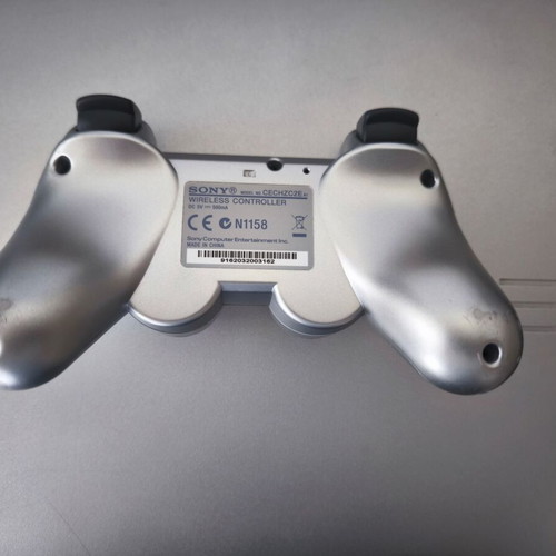 Sony PlayStation 3 Slim Satin Silver 320GB console with original DualShock 3 used
