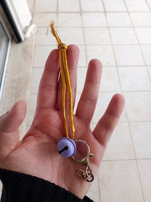 Keychain with metal bell and cord used