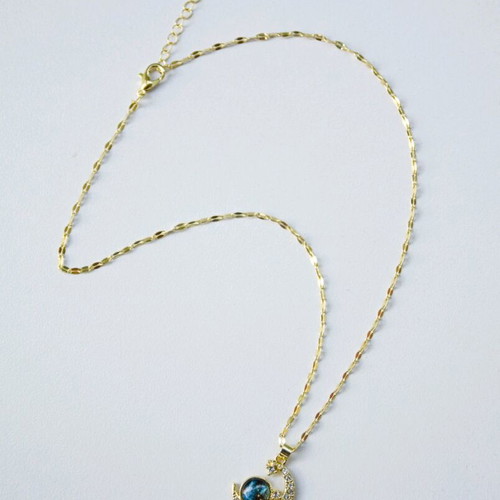 Stainless steel necklace like new with crescent moon and blue sphere