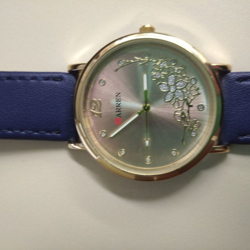 Women's watch new with blue strap and gold details