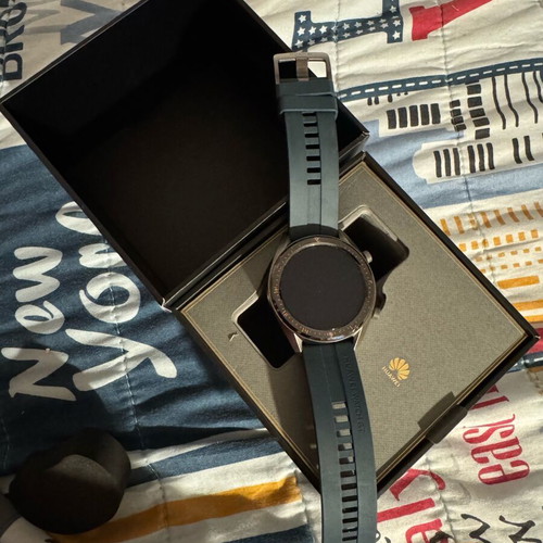 Huawei GT smartwatch used with charging base and fabric straps