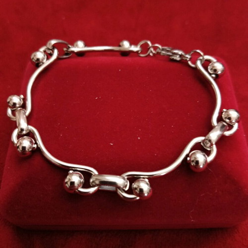 Stainless steel bracelet new, silver with intricate fastening