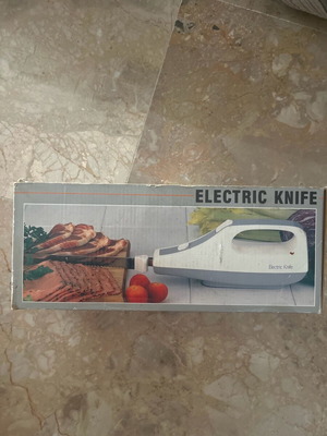 Electric knife like new in white and gray color