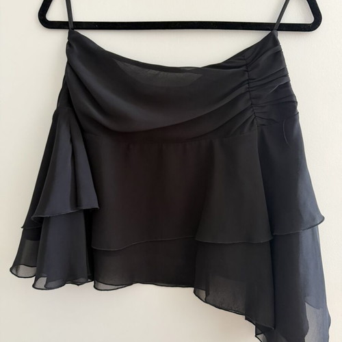 Black airy skirt with ruffles, asymmetrical hem