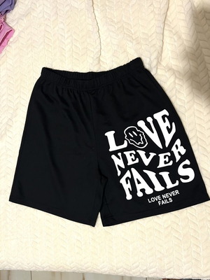 Basketball shorts black with white letters size medium