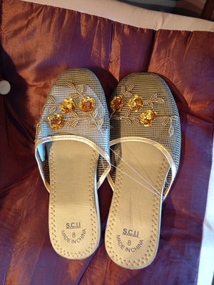 Slippers new, gold color