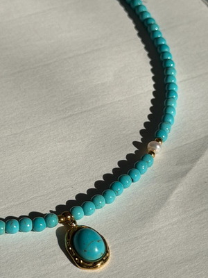 Handmade necklace with turquoise haolite, hematite, and pendant
