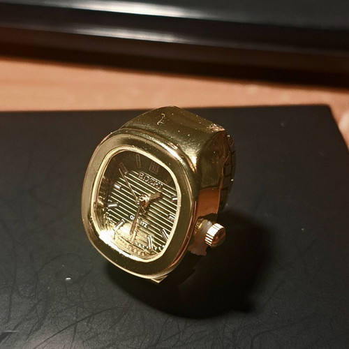 Ring watch with khaki dial and gold bracelet