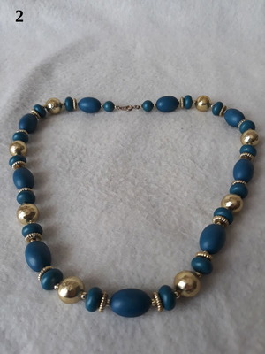 Vintage necklace like new with blue and gold beads in various shapes