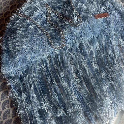 Handmade knitted shoulder bag turquoise with fringes and fluffy texture