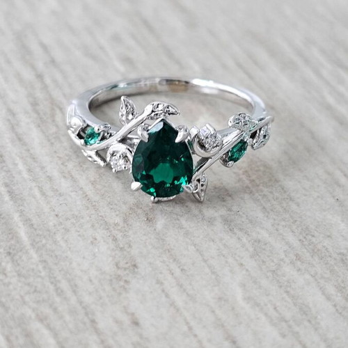 14K White Gold Engagement Ring with Emerald and Moissanite