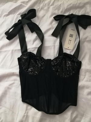 Women's black bustier corset top with sequins and sheer waist