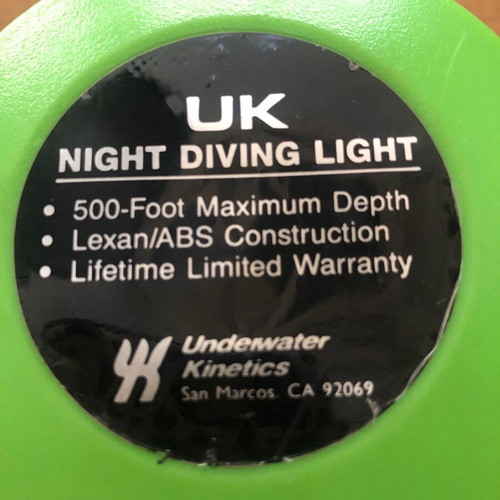Underwater Kinetics UK1200 halogen underwater flashlight used with handle and strap