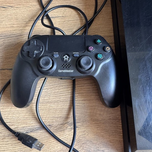 PlayStation 4 Fat 500GB console used with GameMaster wired controller