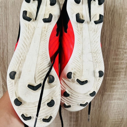Nike football shoes like new, sizes 22 and 35, black and red
