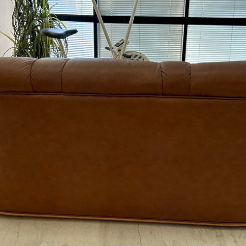 Leather three-seater sofa used, brown color