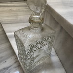 Glass liquor bottle used with embossed design