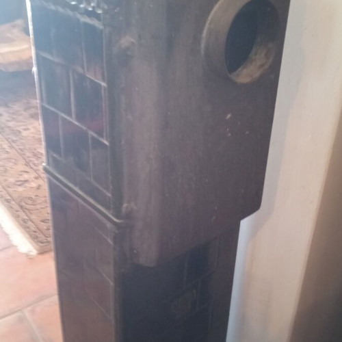 Cast iron stove used for briquettes and wood