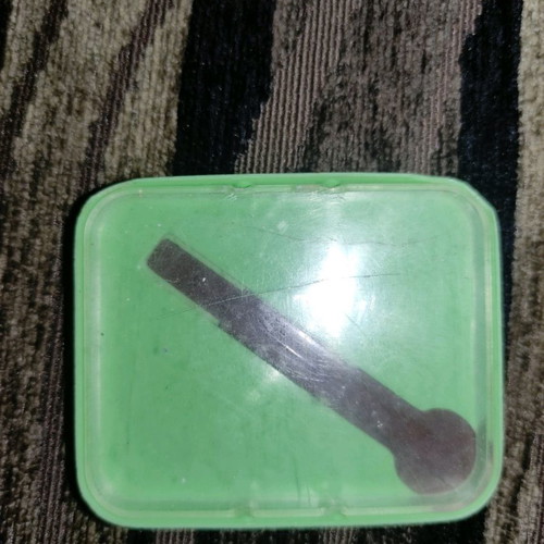 Old aspirin box used with front crack