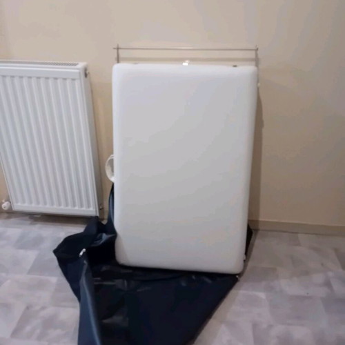 Massage bed like new, white with nickel base and folding feature