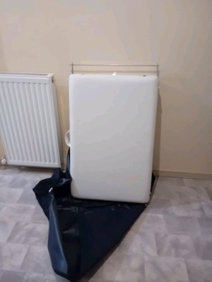Massage bed like new, white with nickel base and folding feature