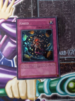 Greed Yu-Gi-Oh! trap card near mint