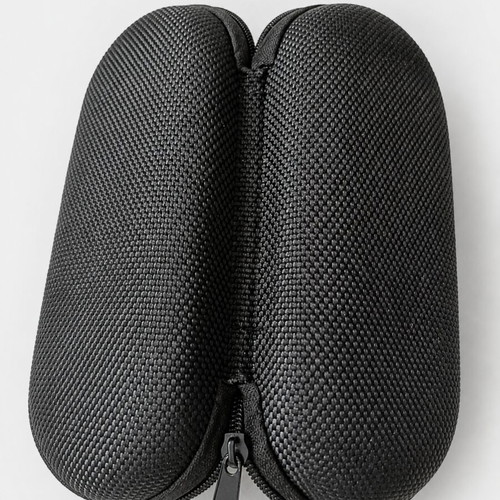 Black hard-shell glasses case with zip closure