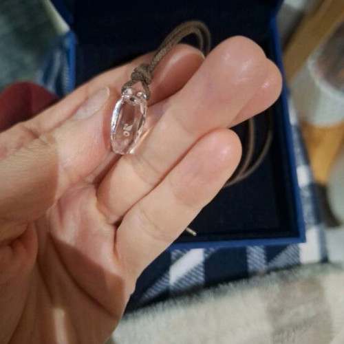 Swarovski necklace like new, transparent with brown cord
