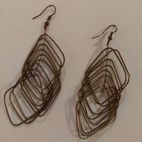 Dangling earrings used, brown and gold color