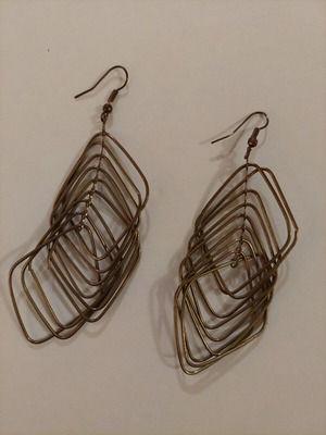 Dangling earrings used, brown and gold color