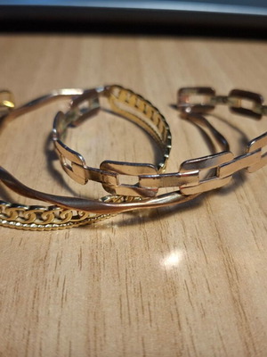 Set of 3 gold-colored bracelets like new with various designs