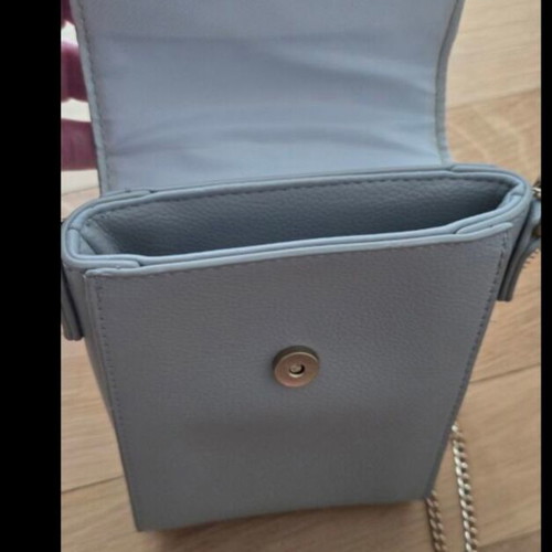 Small blue crossbody bag with chain and studs