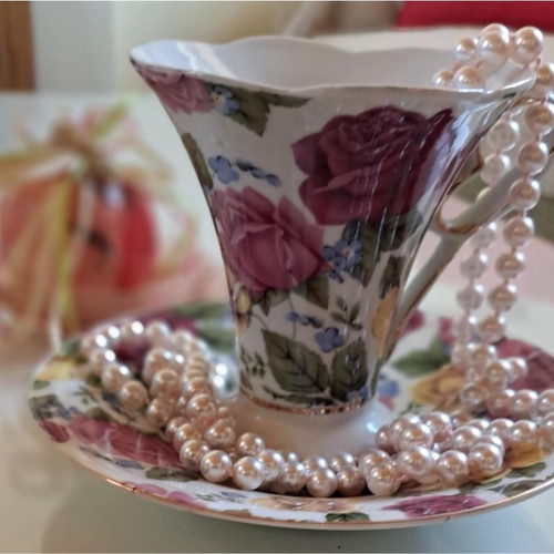 Porcelain cup with saucer like new, floral design