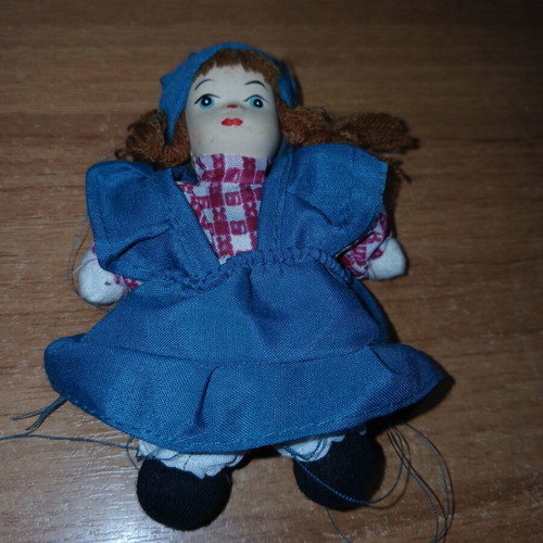 Porcelain doll small, used