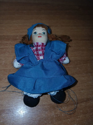 Porcelain doll small, used