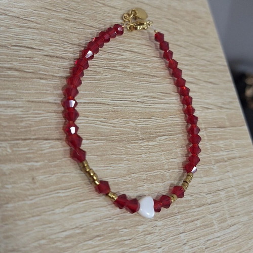 Handmade bracelet with crystals, pearls and heart-shaped coral made to order