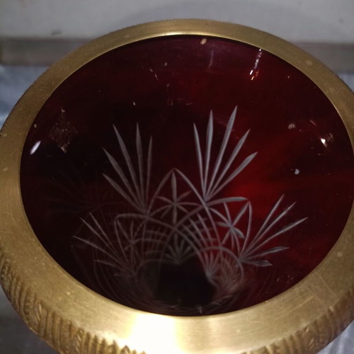 Vintage red glass vase with cut designs and decorative brass base and rim
