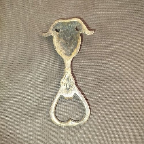 Bronze bottle opener used