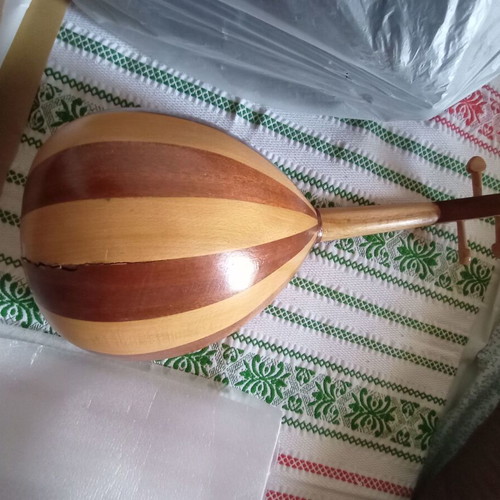 Mini tambouras used, wooden with crack