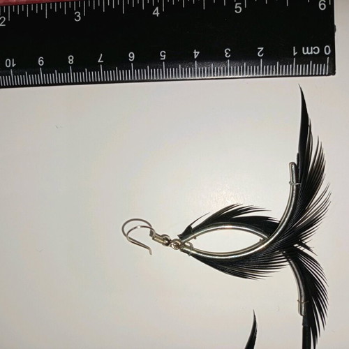 Fallen Angel earrings like new with black hanging feathers