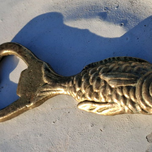 Vintage brass fish-shaped bottle opener used