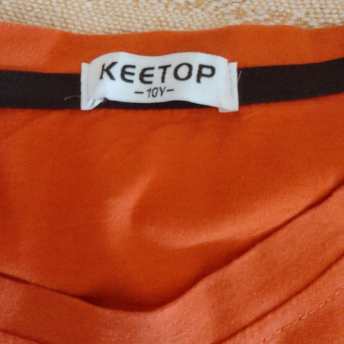 T-shirt orange for boy 10Y like new with skateboard print