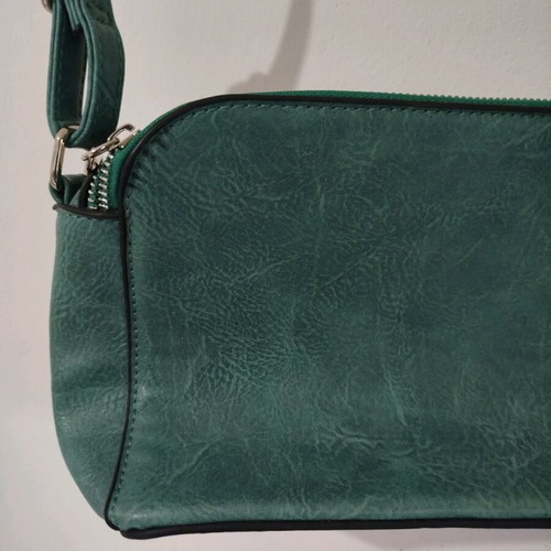 Turquoise shoulder bag with three compartments used