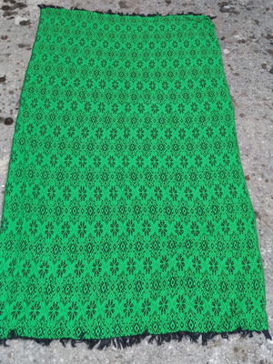 Traditional woven cover like new, green with black geometric patterns