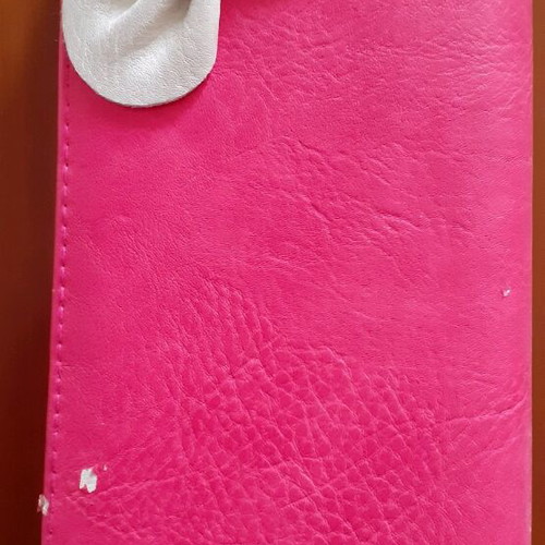Pink wallet used with white bow